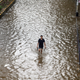 Wading through the floodwaters.